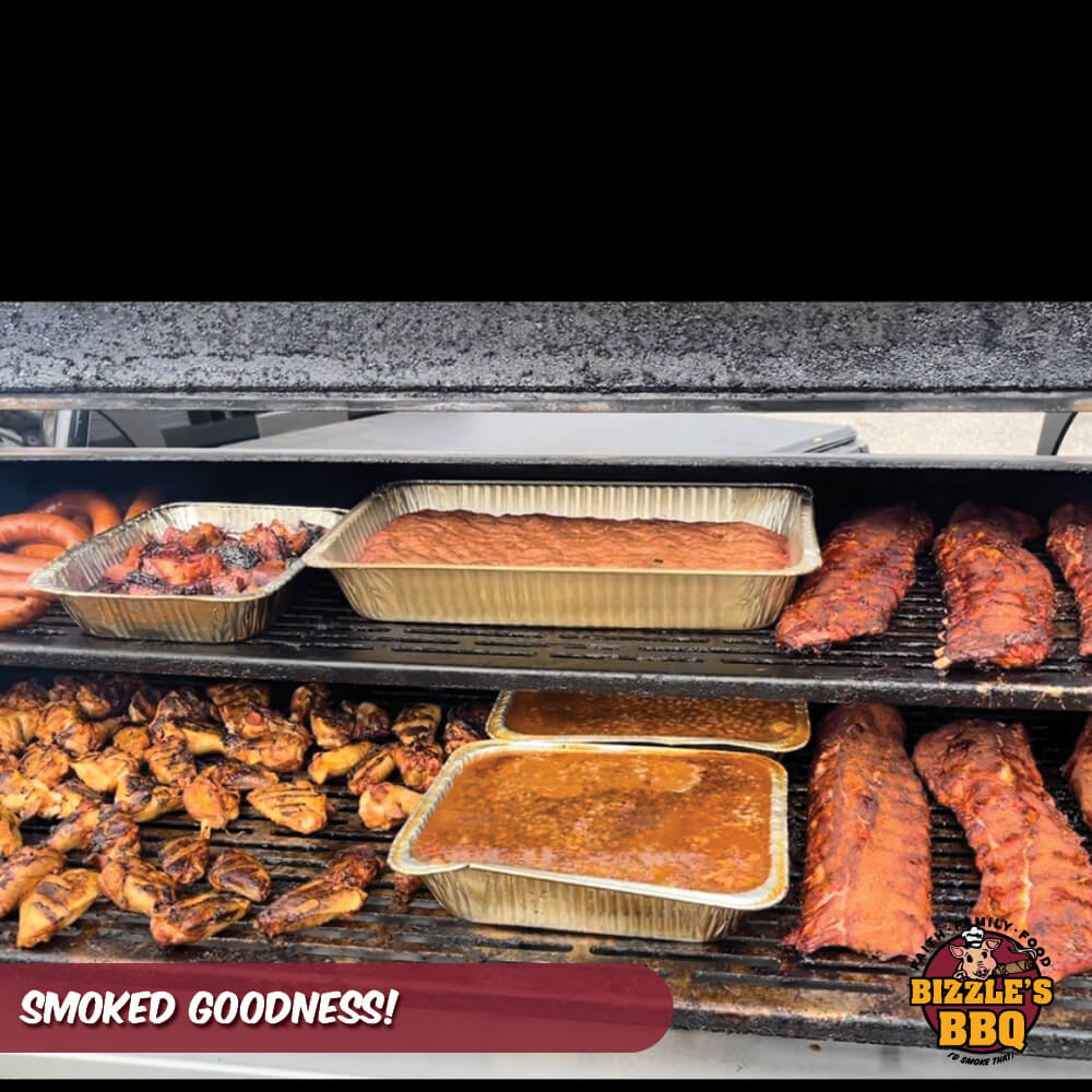 a variety of smoked meats in a smoker